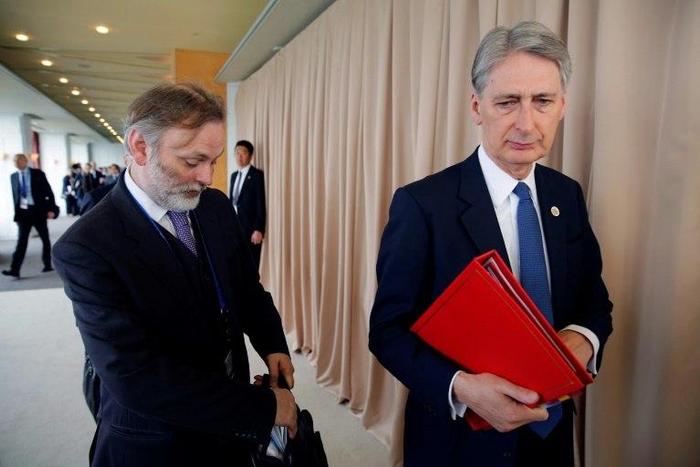 Former UK ambassador to Russia Tim Barrow (L) and Britain's Foreign Minister Philip Hammon arrive for the fourth session of the G7 Foreign Ministers' meeting in Hiroshima on April 11, 2016