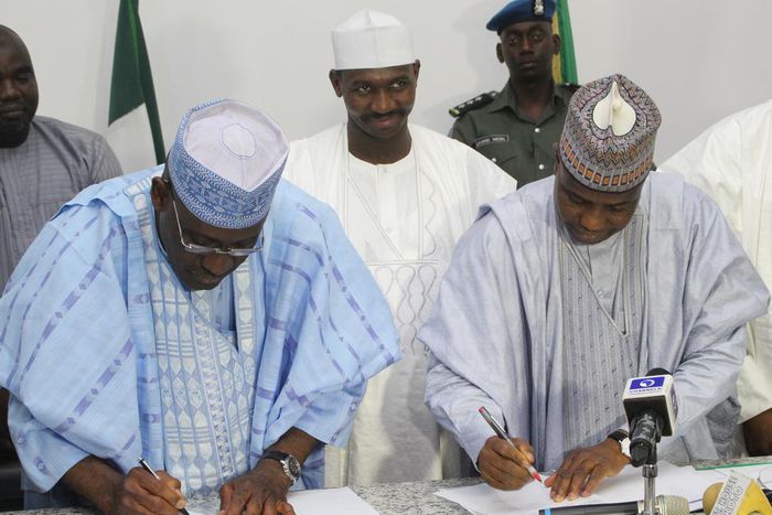 L-R: Ag Managing Director of Bank of Industry, Mr. Wahid Olagunju and Sokoto State Governor, Aminu Waziri Tambuwal, signing an agreement to provide N2billion to SMEs in Sokoto. Middle of Deputy Governor Ahmed Aliyu.