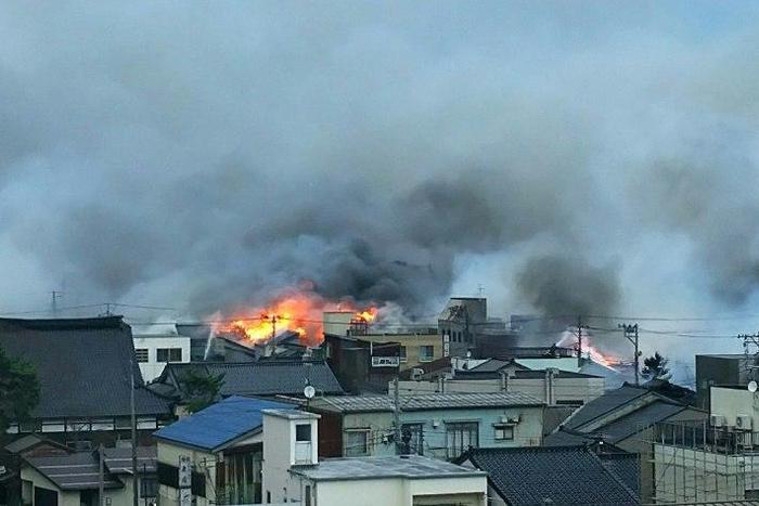 Flames and smoke engulf homes in Itoigawa city, Niigata prefecture on December 22, 2016