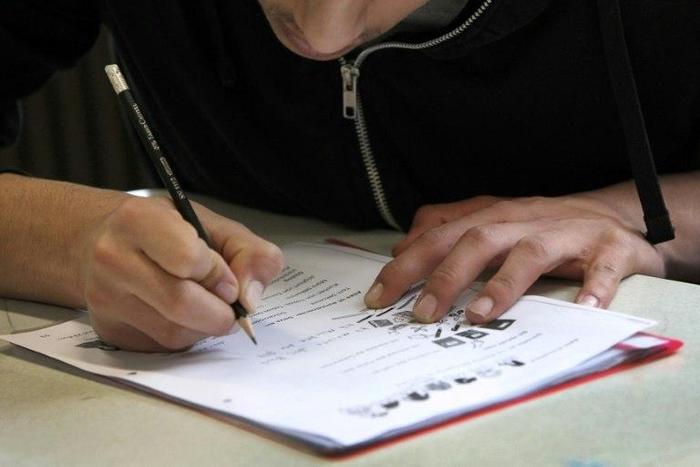 A refugee student attends a class at the Heinrich-von-Brentano School in Hochheim am Main, Germany, in a step back to a normal life