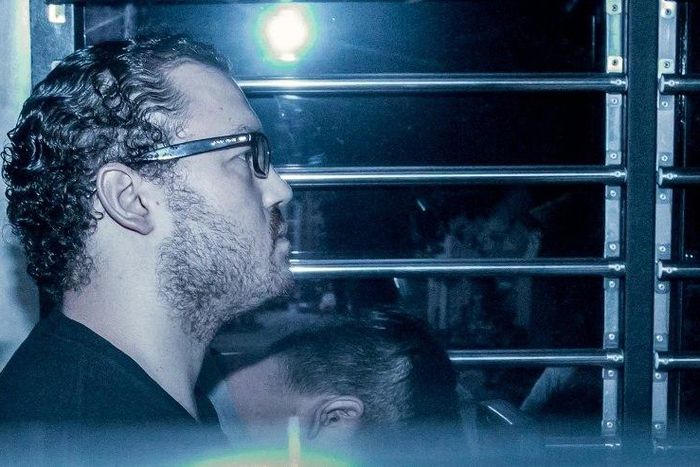 British banker Rurik Jutting sits in a prison van as he arrives at a Hong Kong court for a hearing in May 2015