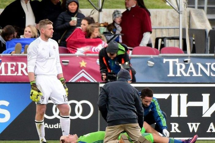 Jordan Morris of Seattle Sounders receives attention from staff in front of goaltender Zac MacMath of Colorado Rapids after an injury during his goal for a 1-0 lead at Dick's Sporting Goods Park on November 27, 2016