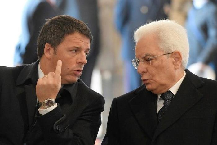 Italy's President Sergio Mattarella (R) speaks with Italys' former Prime Minister Matteo Renzi before a ceremony for the closing of the Jubilee of Mercy, on November 20, 2016