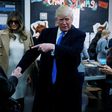 Republican presidential nominee Donald Trump shakes hands with a woman before voting at PS 59 in New York, New York, U.S. November 8, 2016