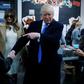 Republican presidential nominee Donald Trump shakes hands with a woman before voting at PS 59 in New York, New York, U.S. November 8, 2016