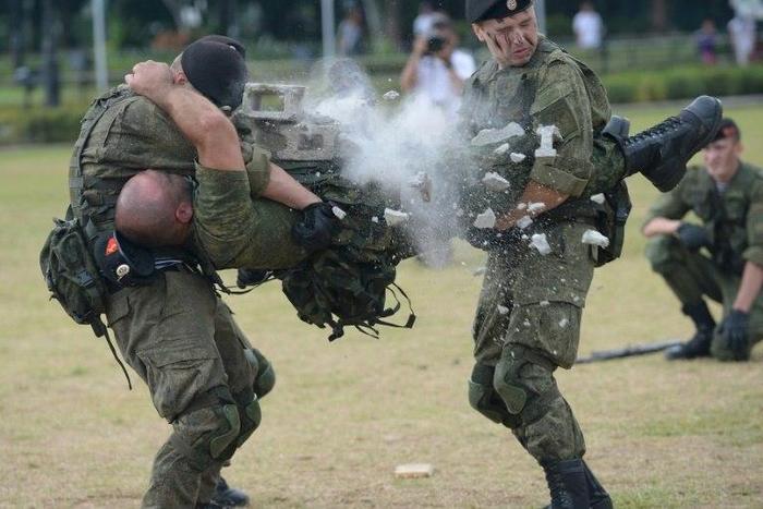 Russian marines attached to the anti-submarine ship Admiral Tributs show their skills during a demonstration at a park in Manila on January 5, 2017