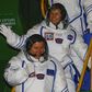 Members of the main crew of the expedition to the International Space Station, Russia's cosmonaut Oleg Novitsky (L) and US astronaut Peggy Whitson wave as they walk to board the rocket at the Russian-leased Baikonur cosmodrome in Baikonur