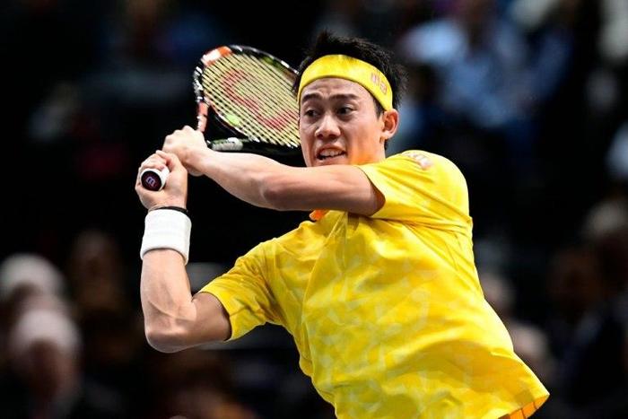Japan's Kei Nishikori in action against Serbia's Viktor Troicki at the Paris Masters on November 2, 2016