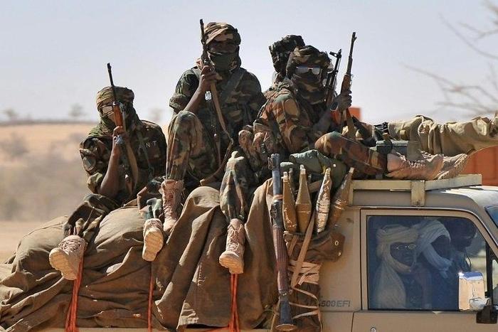 Soldiers of the Chadian army are driven in a pickup near Iriba, northern Chad on March 12, 2009