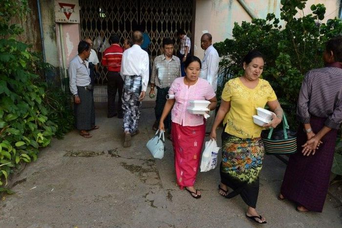 Myanmar Muslim devotees depart a private meeting hall after hardline Buddhist nationalists stopped a Muslim ceremony on January 8, 2017