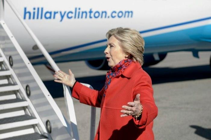Democratic presidential candidate Hillary Clinton speaks to the press before boarding her plane at Westchester County Airport, New York, on November 7, 2016