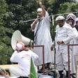 Muslim leaders broadcast their message as they march past Jakarta's governor's office on November 4.