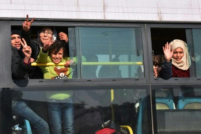 Evacuated Syrians arrive in Jibrin on the eastern outskirts of Aleppo on December 19, 2016