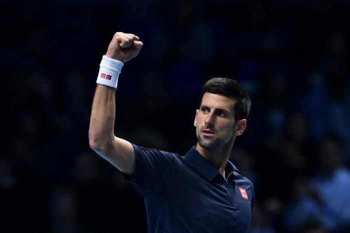 Serbia's Novak Djokovic celebrates beating Japan's Kei Nishikori during their men's semi-final singles match on day seven of the ATP World Tour Finals tennis tournament in London on November 19, 2016