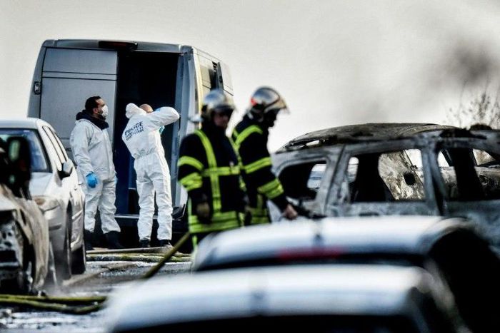 Forensics officers work at the site where thieves held up a van and stole 70 kilograms of gold near Lyon, France, on December 12, 2016
