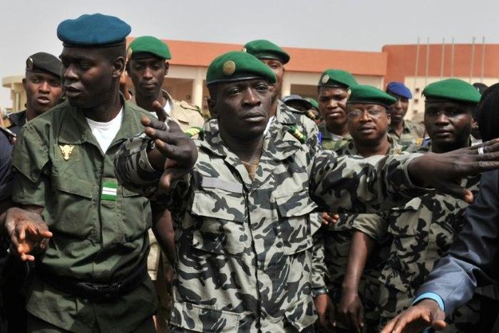 Malian military junta leader Amadou Sanogo (centre) who led the 2012 coup against then president Amadou Toumani Toure stood trial for murder and collusion over the massacre of soldiers who opposed the takeover