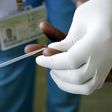 Margaret Muchiri, a counsellor, prepares to get a blood sample from a woman to test for HIV at the Mater Hospital in Kenya's capital Nairobi, September 10, 2015.      REUTERS/Thomas Mukoya