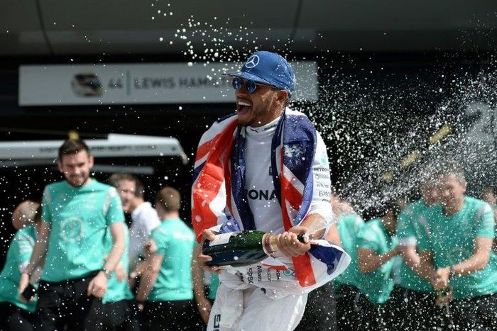 Mercedes driver Lewis Hamilton celebrates after winning the 2016 British Grand Prix at Silverstone