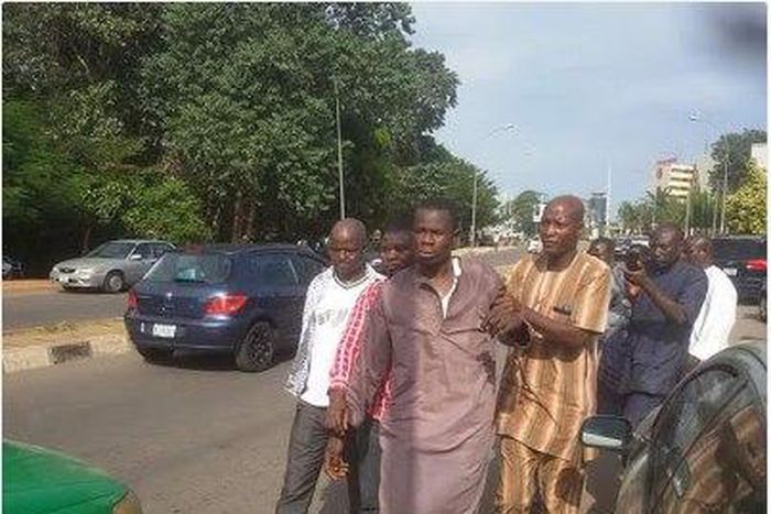 The suspects being taken to the police station