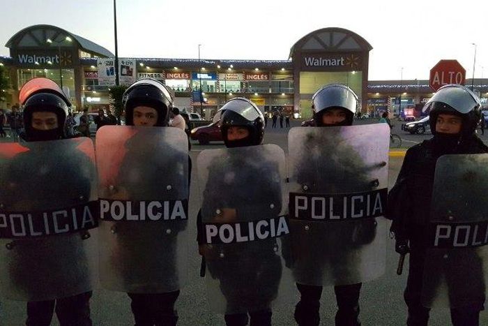 Business leaders said some 1,000 shops and companies had been looted or vandalized as looting and protests against a gasoline price increase erupted for a fifth day