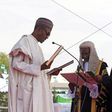 Chief Justice of Nigeria Mahmud Mohammed swears in Muhammadu Buhari (C) as Nigeria's president while Buhari's wife Aisha looks on at Eagle Square in Abuja, Nigeria May 29, 2015. REUTERS/Afolabi Sotunde/File Photo