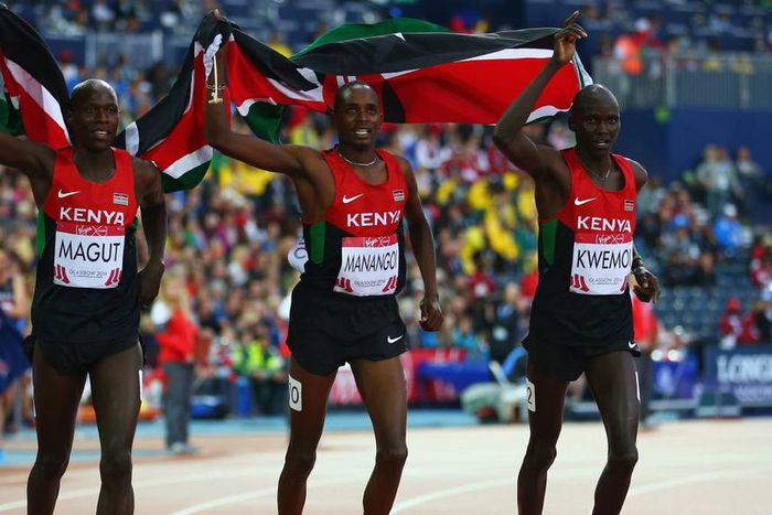 Gold medalist James Kiplagat Magut of Kenya, Elijah Motonei Manangoi of Kenya and silver medalist Ronald Kwemoi of Kenya celebrate after the Men's 1500 metres final at the 2014 Commonwealth Games.
