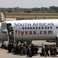 Passengers board a South African Airways Boeing 737 aircraft at the Kamuzu International Airport in Lilongwe October 25, 2009.