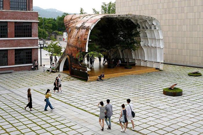 Old rusty ship turned into stunning building with trees 