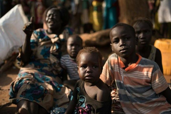 Families wait to find shelter in Juba on July 12, 2016 