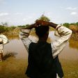 A Sudanese man looks at the river Gash that burst its banks flooding the village of Makli on August 14, 2016, destroying thousands of houses and submerging several villages 
