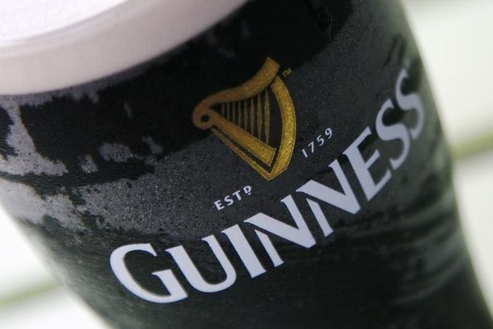 A pint of Guinness beer is seen outside a pub in London, file.