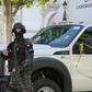 A member of the Tunisian security forces stands guard at the site of a suicide attack in the capital Tunis on October 29, 2018
