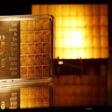 The symbol AU for the chemical element of gold is seen next to one-gram gold bars on display at the annual meeting of German Sparkasse savings banks in Duesseldorf, Germany, April 27, 2016.