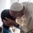 Pope Francis surprised 20 former prostitutes on Friday by knocking on their door in Rome and popping in for a chat. He is pictured here greeting one of the women
