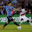 Uruguay's Luis Suarez and Peru's Christian Ramos.