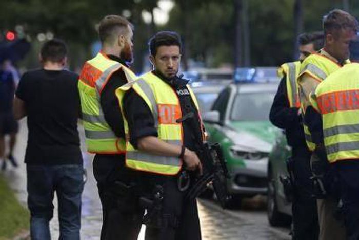 Police secure a street near to the scene of a shooting in Munich, Germany July 22, 2016.
