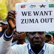 A member of a group planning to stage an ‘Occupy’ protest outside the ANC headquarters demanding South African President Jacob Zuma and other senior party officials to resign, holds a placard in downtown Johannesburg, South Africa, September 5, 2016.