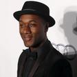 U.S. musician Aloe Blacc poses upon arrival at the Foundation for AIDS Research (amfAR) fundraising gala in Hong Kong, China March 19, 2016.