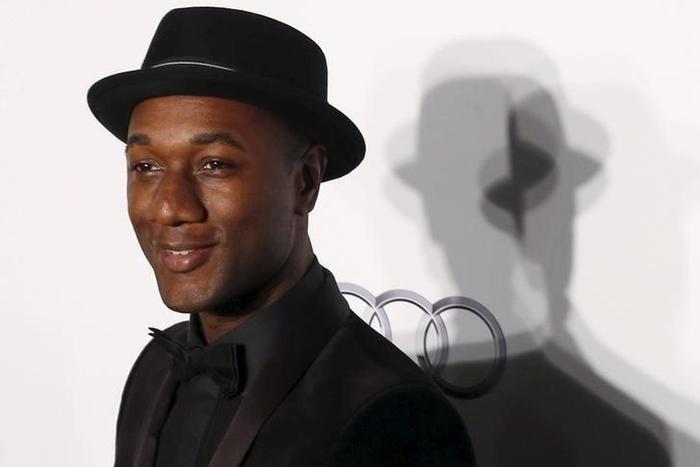U.S. musician Aloe Blacc poses upon arrival at the Foundation for AIDS Research (amfAR) fundraising gala in Hong Kong, China March 19, 2016.