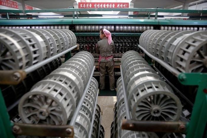 A woman works at the Kim Jong Suk Pyongyang textile mill during a government organised visit for foreign reporters in Pyongyang, North Korea May 9, 2016.
