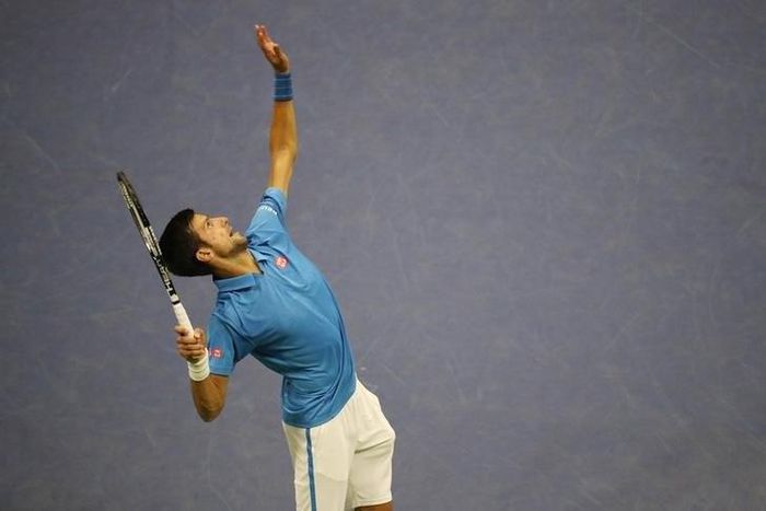 Novak Djokovic of Serbia serves to Jerzy Janowicz of Poland on day one of the 2016 U.S. Open tennis tournament at USTA Billie Jean King National Tennis Center.