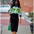 Monica looks great in this floral blouse and corduroy skirt