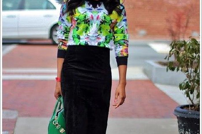 Monica looks great in this floral blouse and corduroy skirt