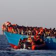 A rescue boat of the Spanish NGO Proactiva approaches an overcrowded wooden vessel with migrants from Eritrea, off the Libyan coast in Mediterranean Sea August 29, 2016.