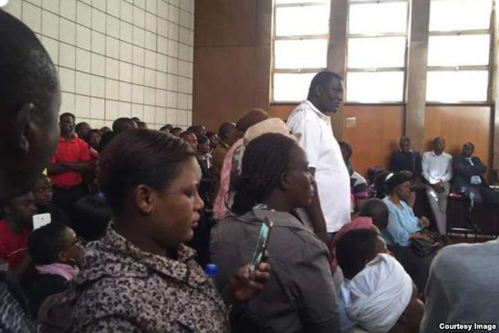 Zimbabwe charges 68 with violence after protests, activist denied bail