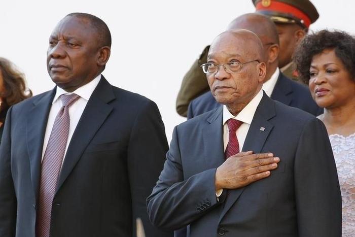 South Africa's Deputy President Cyril Ramaphosa and President Jacob Zuma stand during the playing of the national anthem at the opening of Parliament in Cape Town, in this February 11, 2016 file photo.
