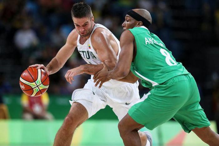 D'Tigers baller attacks Lithuania opponent during their second game at the Rio 2016 Olympics.