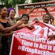 Members of the #BringBackOurGirls (#BBOG) campaign react on the presentation of a banner which shows "218", instead of the previous "219", referring to kidnapped Chibok school girls, during a sit-out in Abuja, Nigeria May 18, 2016, after receiving news...
