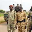 South Sudan National security members stand guard as they protect internally displaced people during a reallocation at the United Nations Mission in South Sudan (UNMISS) compound at the UN House in Jebel, in South Sudan's capital Juba, August 31, 2016....
