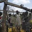 South Sudanese women collect water in the United Nations protection of civilians site hosting about 30,000 people displaced during the recent fighting in Juba, South Sudan, July 22, 2016.